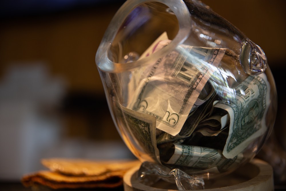 Tip jar with money